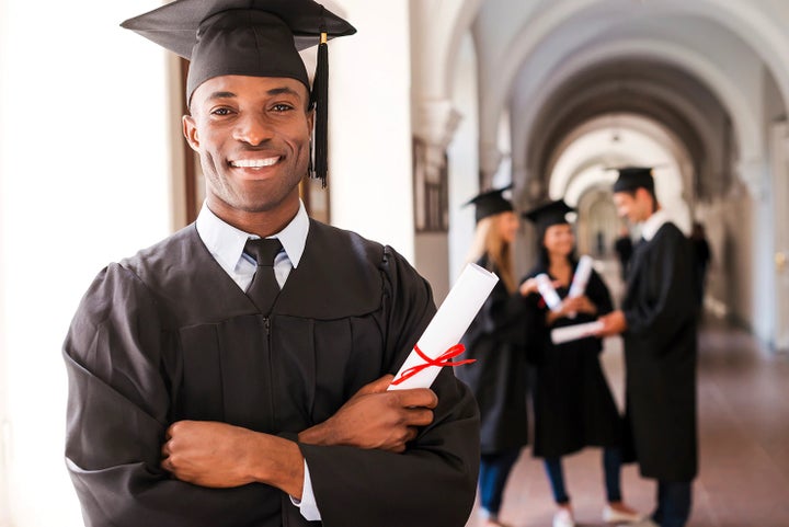 college graduate holding his diploma | Marin Subaru in San Rafael CA